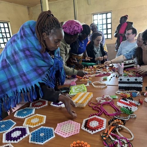 women making beaded crafts